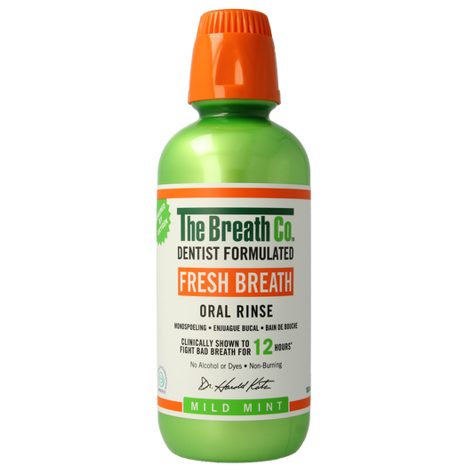 The Breath Co Mild Mint mouthwash in a 500ml bottle, showing the product label and transparent liquid.