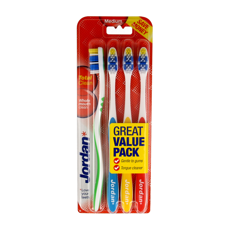 Set of four Jordan TotalClean medium toothbrushes with blue and white handles, designed for effective oral hygiene.