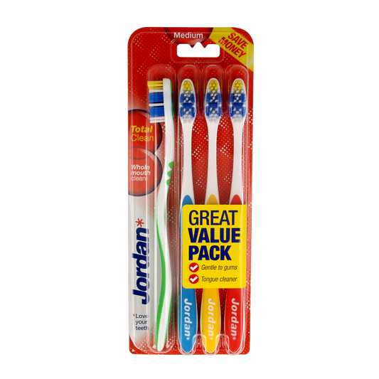 Set of four Jordan TotalClean medium toothbrushes with blue and white handles, designed for effective oral hygiene.