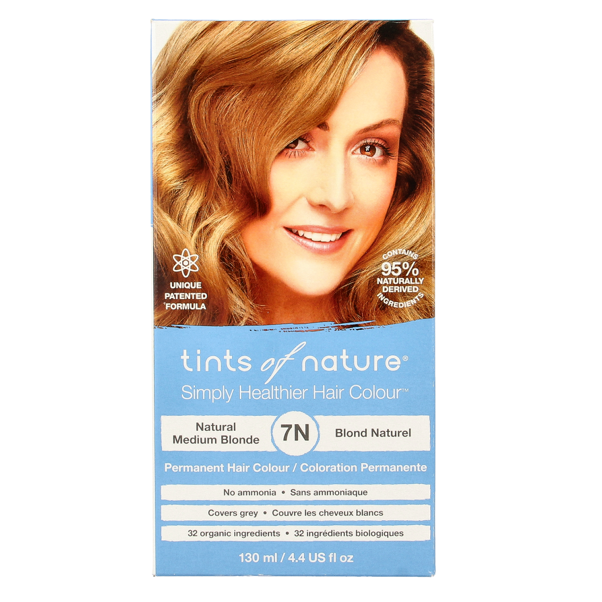 Tints Of Nature 7N medium blonde hair coloring set with natural ingredients, featuring a bottle of hair dye and applicator tools.