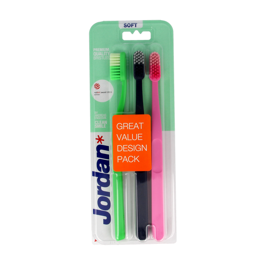 Jordan Clean Smile soft toothbrushes, set of 3, showing three white toothbrushes with soft bristles and ergonomic handles.