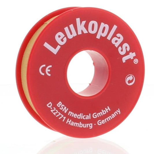 Leukoplast Hechtpleister adhesive bandage 9.2m x 1.25cm, sterile tape for wound dressing, shown rolled in a medical setting