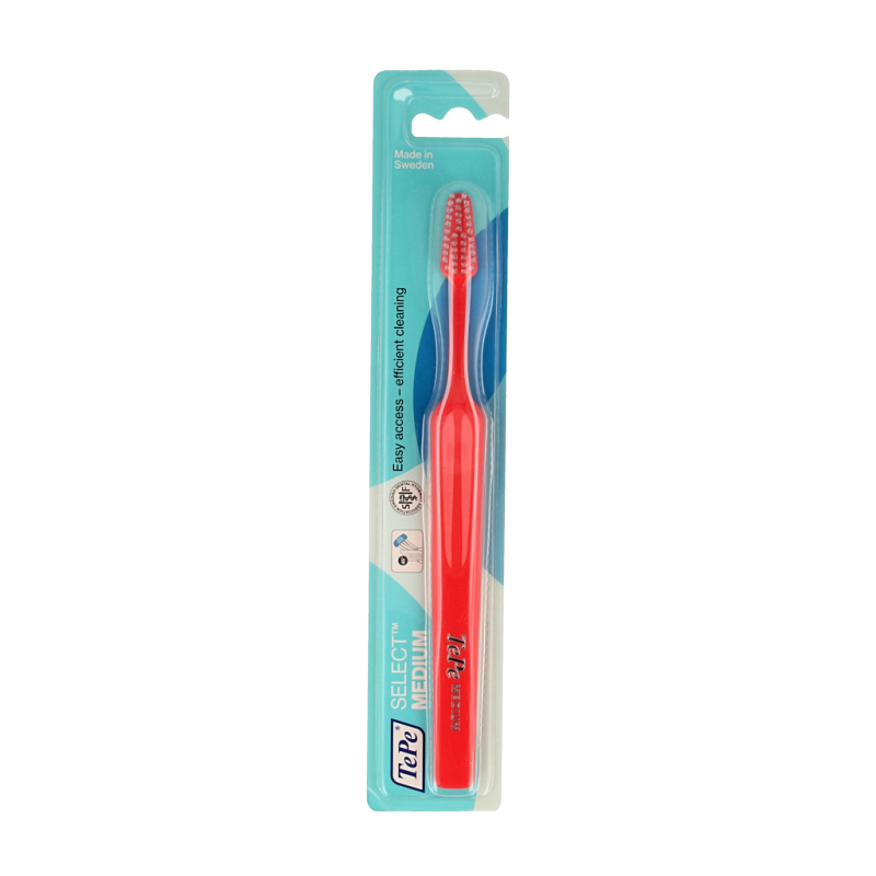TePe medium toothbrush with soft bristles, designed for effective oral cleaning, shown in a close-up image.