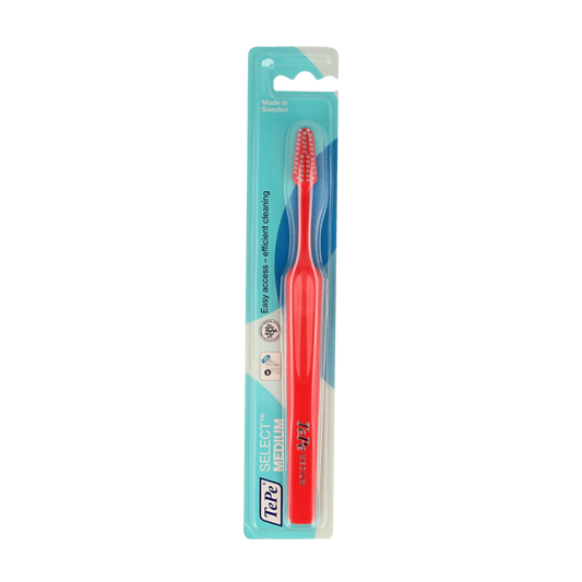 TePe medium toothbrush with soft bristles, designed for effective oral cleaning, shown in a close-up image.
