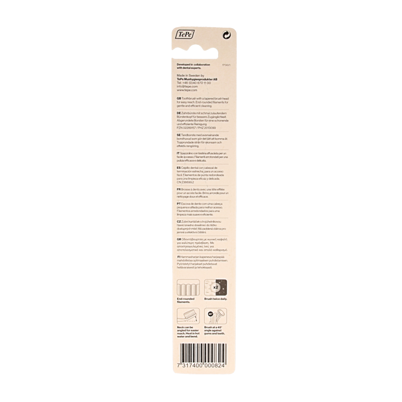 TePe medium toothbrush with white handle and blue bristles, designed for effective dental cleaning.