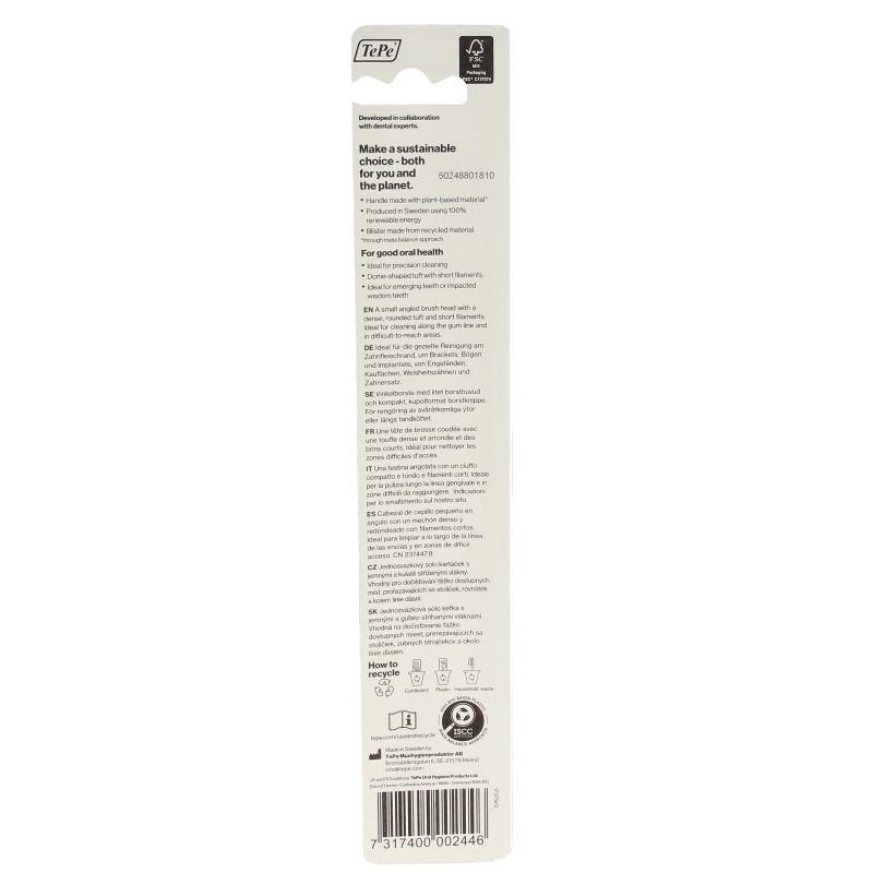 TePe compact tuft toothbrush with white handle and bristles, designed for precise cleaning and oral hygiene.