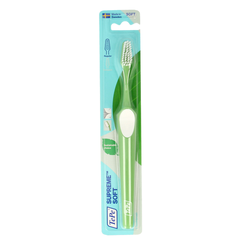 TePe Supreme toothbrush in white, designed for effective oral cleaning, with a sleek handle and soft bristles.