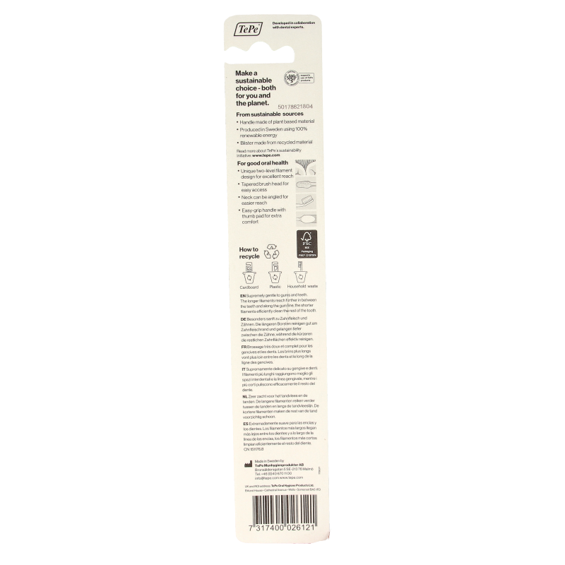 TePe Supreme toothbrush in white, close-up of soft bristles and ergonomic handle for effective oral cleaning