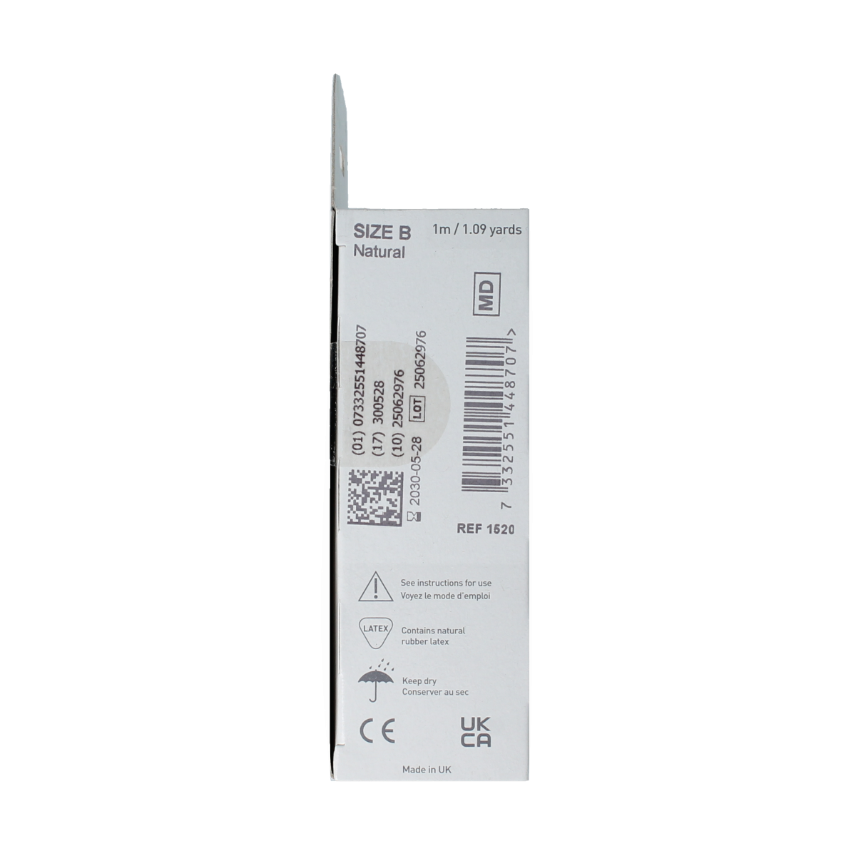 Tubigrip elastic tubular bandage in white, B size, 1520 mm length, used for compression and support.