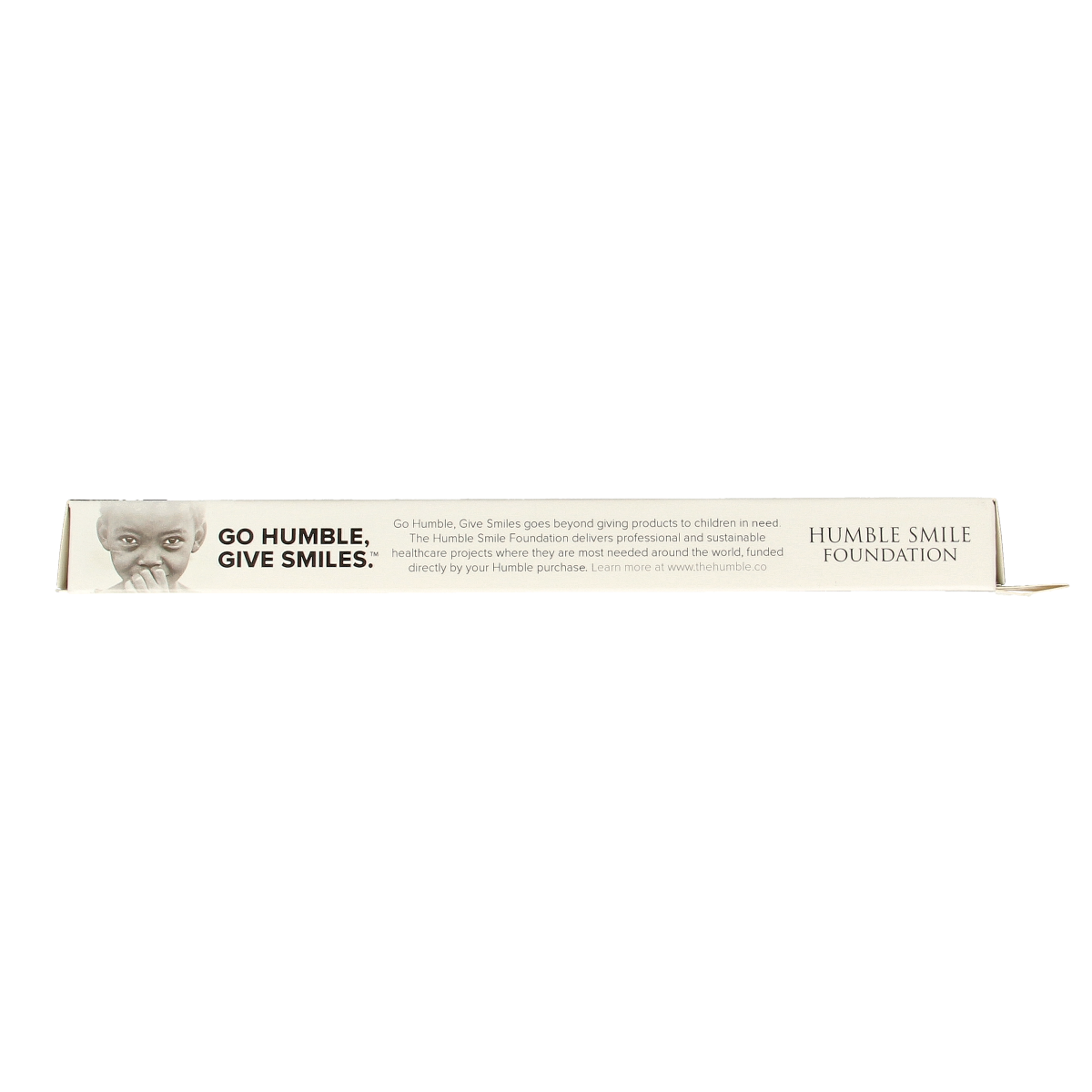 The Humble Co bamboo charcoal toothbrush with natural wooden handle and black charcoal bristles, eco-friendly dental care.