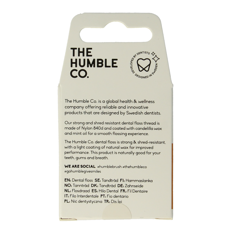 The Humble Co cinnamon dental floss 50 meters, designed for oral hygiene and plaque removal, shown unspooled in the image.