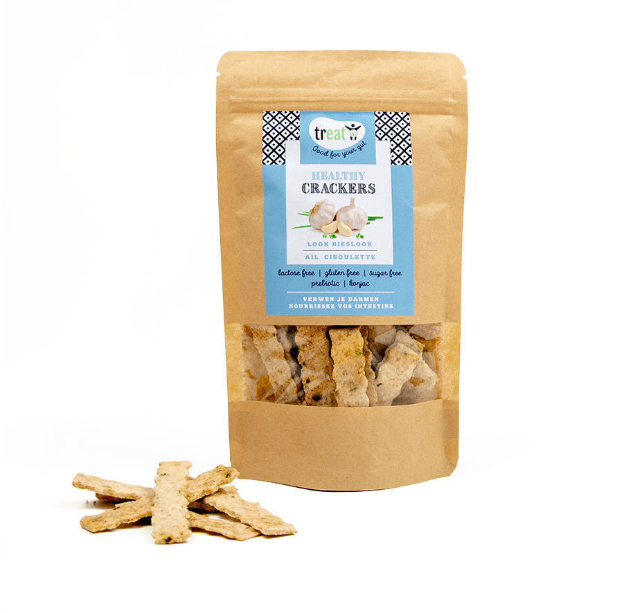 Treat Crackers look bieslook gluten-free crackers on a wooden surface, showing their crispy texture and fresh bieslook garnish.
