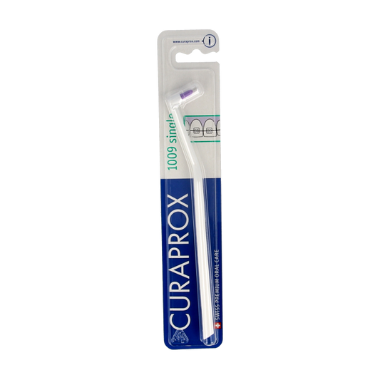 Curaprox CS 1009 single toothbrush in assorted colors, soft bristles, ideal for gentle and effective oral cleaning.
