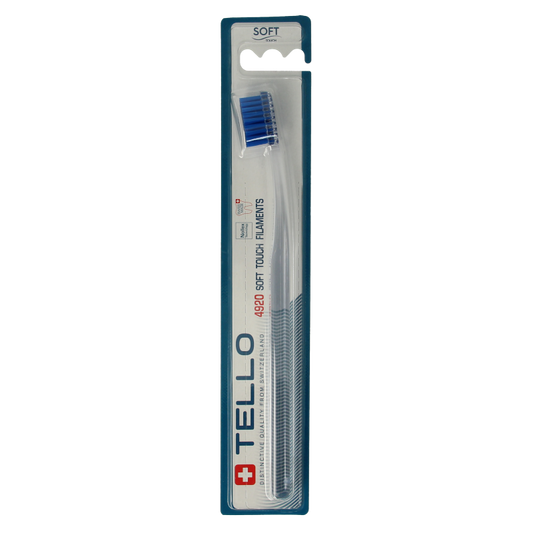 Tello soft toothbrush with white handle and bristles, designed for gentle oral care, shown in close-up image.