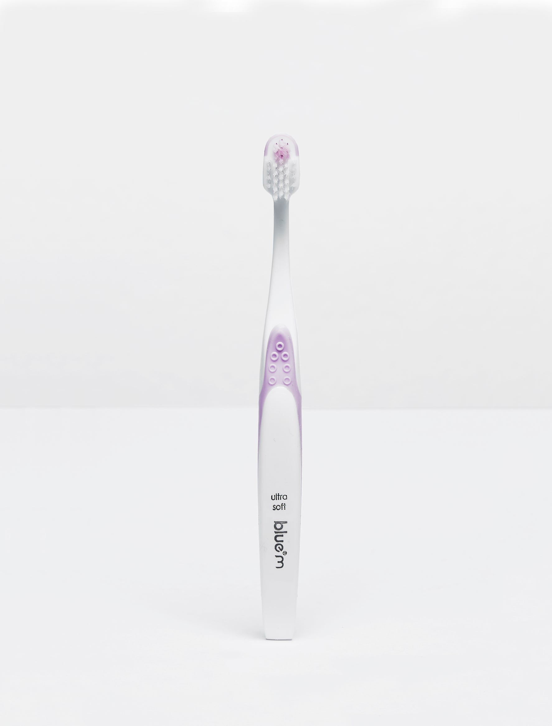 Pink Bluem kids toothbrush with soft bristles, designed for children, shown in the image.