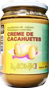 Monki organic salted peanut butter spread on bread, 650g jar, rich and creamy, ideal for sandwiches or snacking.