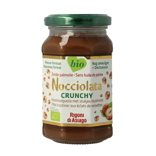 Nocciolata crunchy bio hazelnut spread on bread, 250g jar showing the Nocciolata branding and textured hazelnut spread surface.