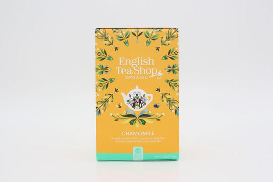 English Tea Shop Chamomile organic tea bags, 20 count, with dried chamomile flowers in a natural tea packaging.