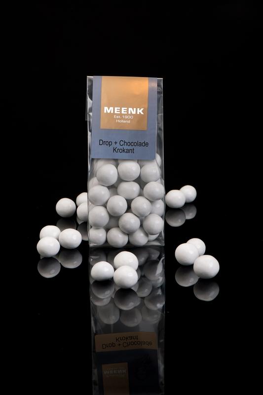 Meenk Drop and chocolade krokant snoepgoed in 150g package, featuring colorful candies and crispy chocolate treats.