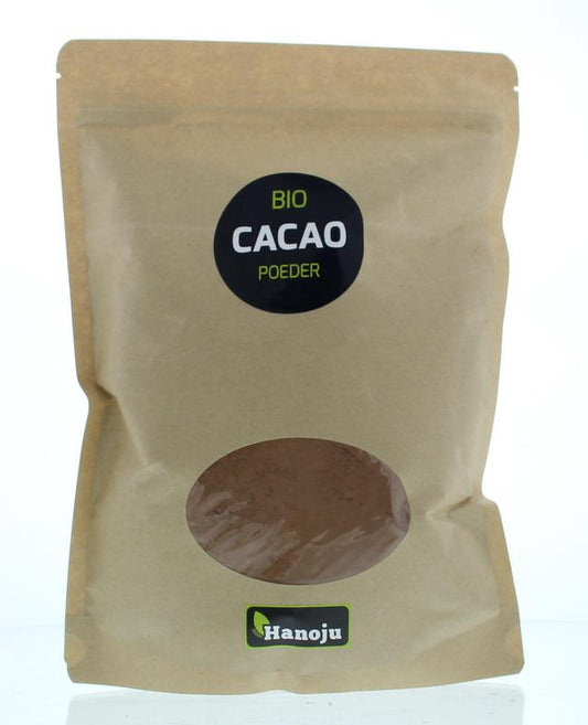 Hanoju organic cacao powder in 500g package, showing rich dark cacao powder in a natural setting with measuring scoop and packaging.