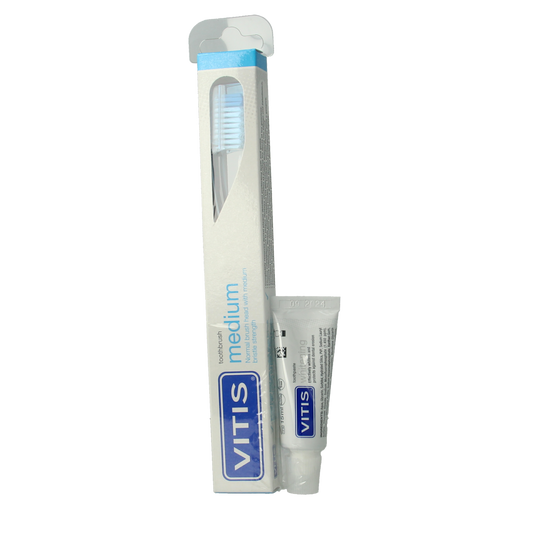 Vitis tandenborstel en tandpasta set, featuring a toothbrush and tube of Vitis toothpaste for oral care.