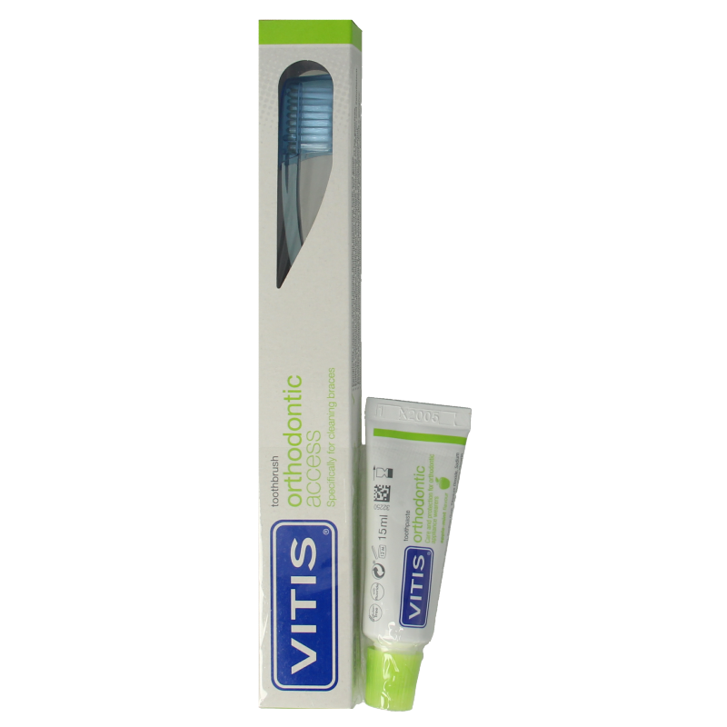Vitis orthodontic access brush with sample toothpaste for dental prostheses, designed for cleaning orthodontic appliances.