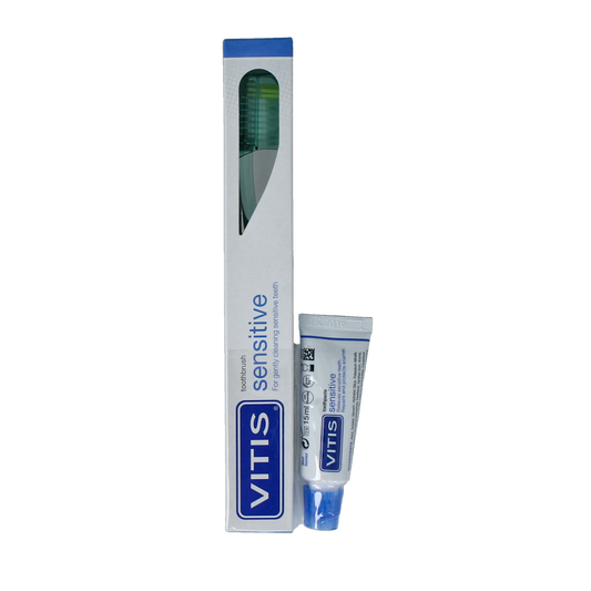Vitis sensitive toothbrush with sample toothpaste set, featuring gentle bristles and ergonomic handle for effective oral care.