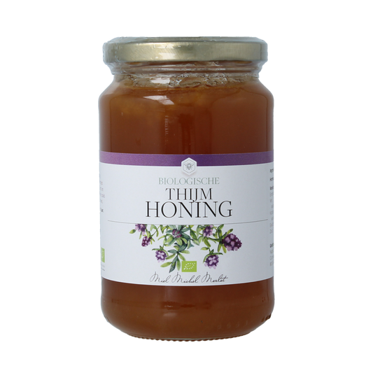 Michel Merlet Thijm bio honing, 500g jar of natural honey with golden color and smooth texture.