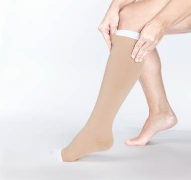 Actico Ulcersys maat S beige and white compression socks set, shown laid out with fabric texture visible.