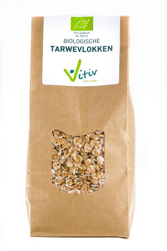 Vitiv bio wheat flakes in a bowl, natural breakfast cereal, 500 grams package, close-up of the organic grain product.