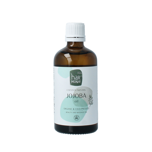 Harmonie Jojoba olie in 100ml bottle, natural body care product with golden liquid in a clear bottle, suitable for skin moisturizing.