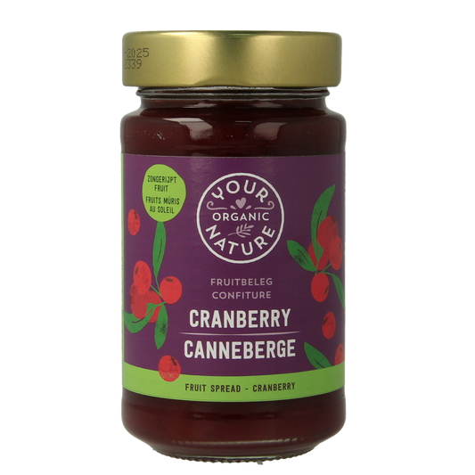 Organic cranberry fruit spread by Your Organic Nature on bread, showcasing a jar of natural, bio cranberry jam for breakfast.