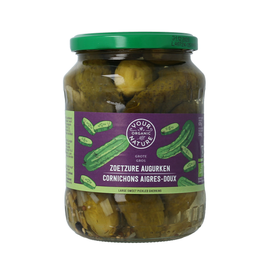 Jar of Your Organic Nature sweet and sour organic pickled cucumbers with potatoes, vegetables, and fruits in a glass jar.