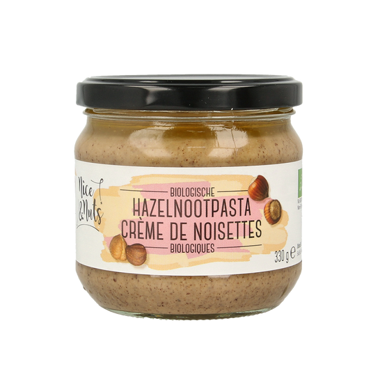 Organic Nice & Nuts hazelnut spread on bread, 330g jar, creamy hazelnut paste for breakfast or snacks.
