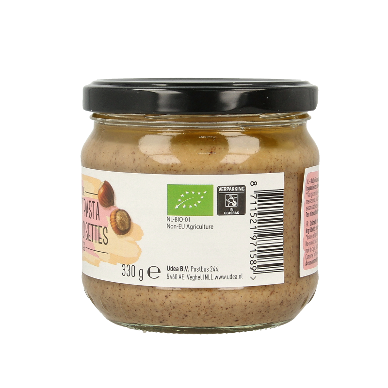 Organic hazelnut spread from Nice & Nuts on bread, 330 grams jar, creamy texture, ideal for spreading or baking.