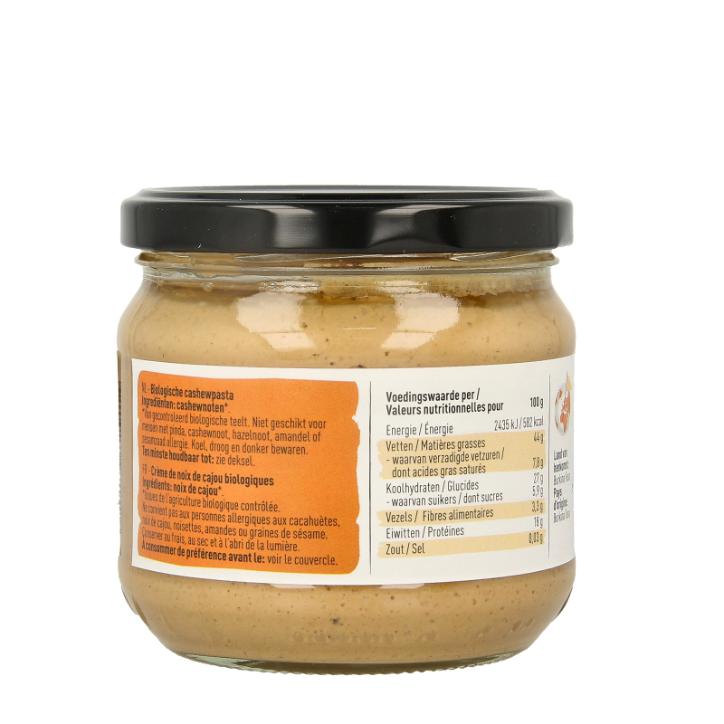 Organic Nice & Nuts Cashewpasta spread on bread, showcasing a creamy texture in a jar, ideal as a wholesome broodbeleg.