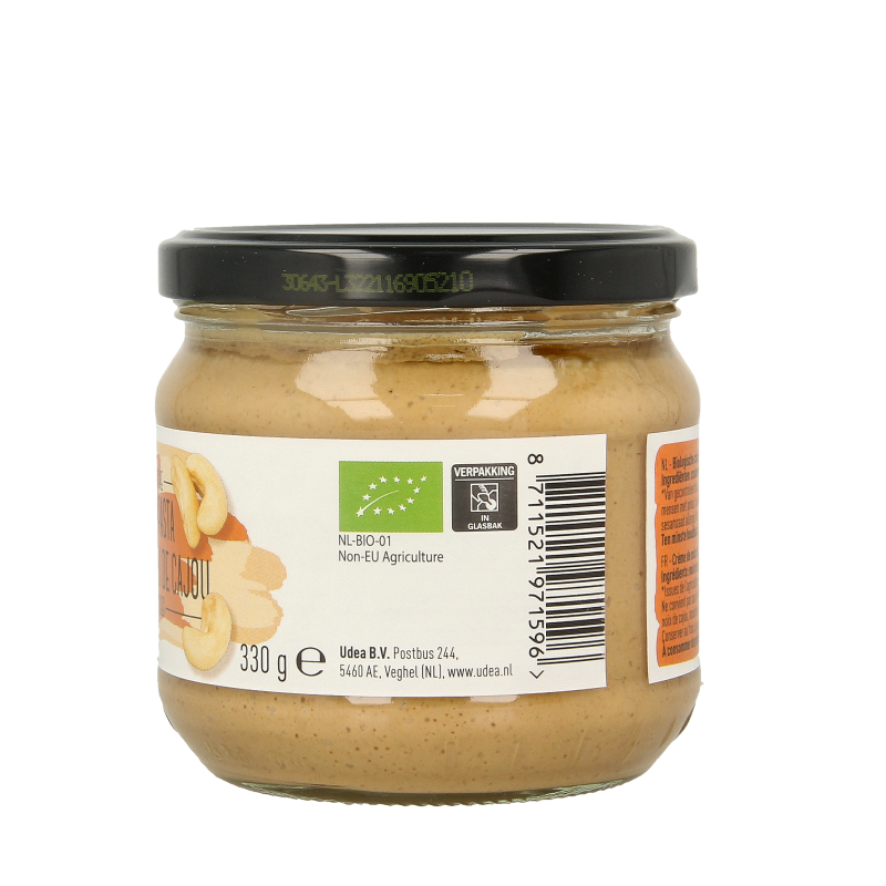 Organic Nice & Nuts Cashewpasta spread on bread, showing creamy texture in a jar. Perfect for healthy snack or sandwich.