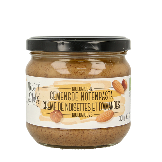 Assorted bio Nut & Noodles spread by Nice & Nuts on bread, showing a creamy, mixed nut topping in a jar.