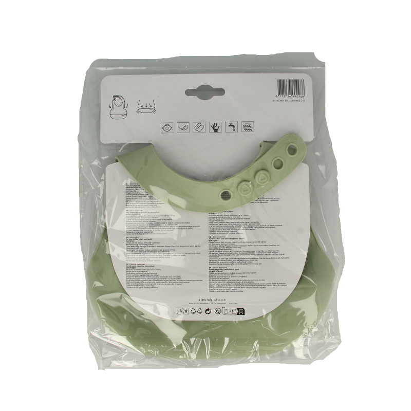 Difrax Lovi slab in pistachio color, a baby and toddler care product, shown in natural setting with packaging.