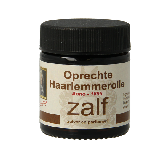 De Koning Tilly Haarlemmerolie zalf, 30ml, kruidenpreparaat with herbal medicinal ointment in a small jar.