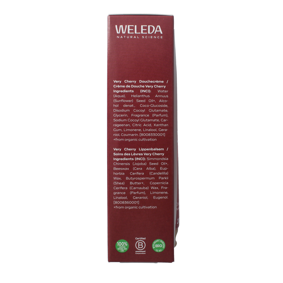 Weleda Very Cherry gift set with body care products, including bottles and tubes, arranged in a festive display.