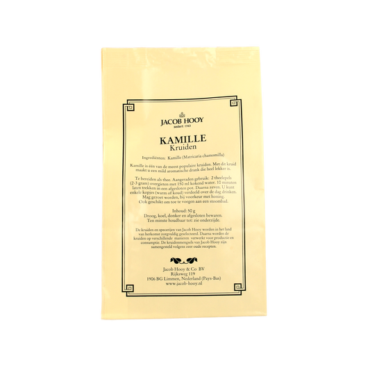 Jar of Jacob Hooy Kamille herbal spice, 50g, with fresh chamomile flowers and dried herbs in a clear container.