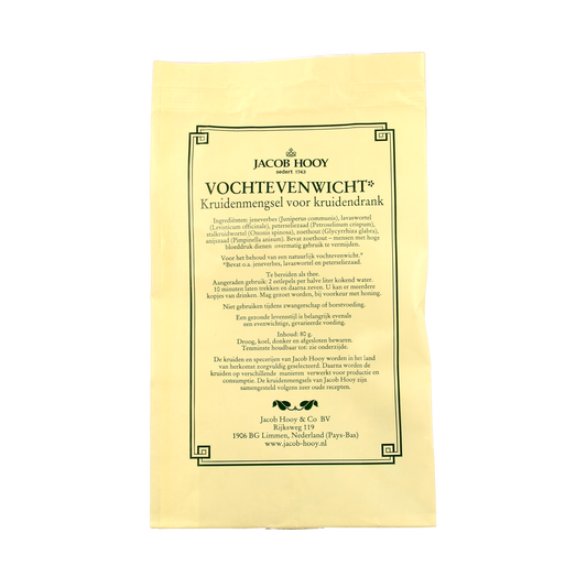 Jar of Jacob Hooy Vochtevenwicht herbal, salt, and meal mix, 80g, with fresh herbs and spices in a clear container.