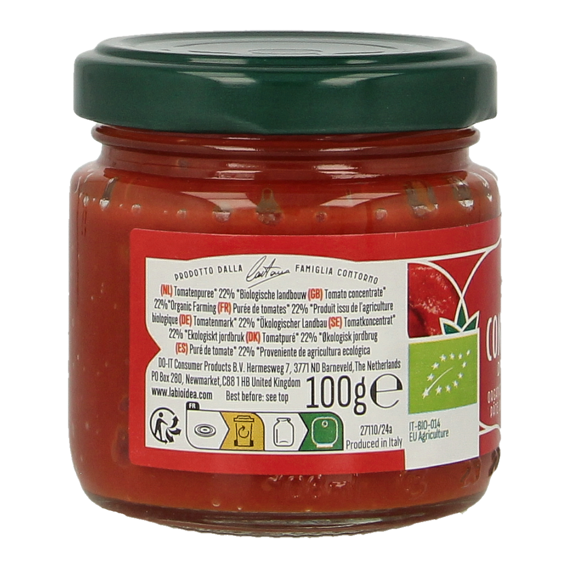 Bioidea organic tomato puree 22% in 100g jar, shown with fresh potatoes and vegetables on a kitchen background.