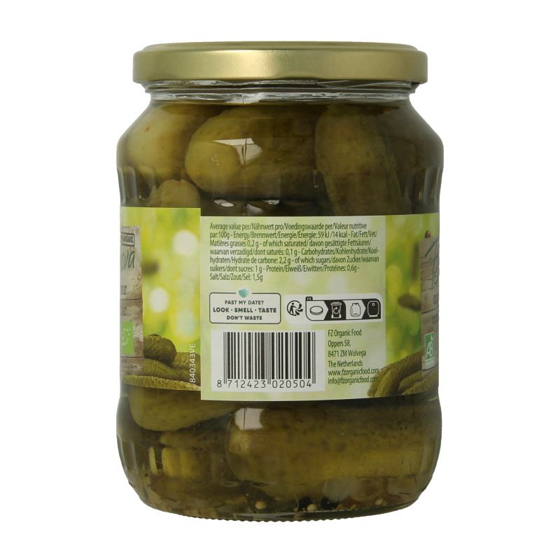 Bionova organic pickled cucumbers in a 670g jar, displayed with fresh vegetables and fruits in the background.