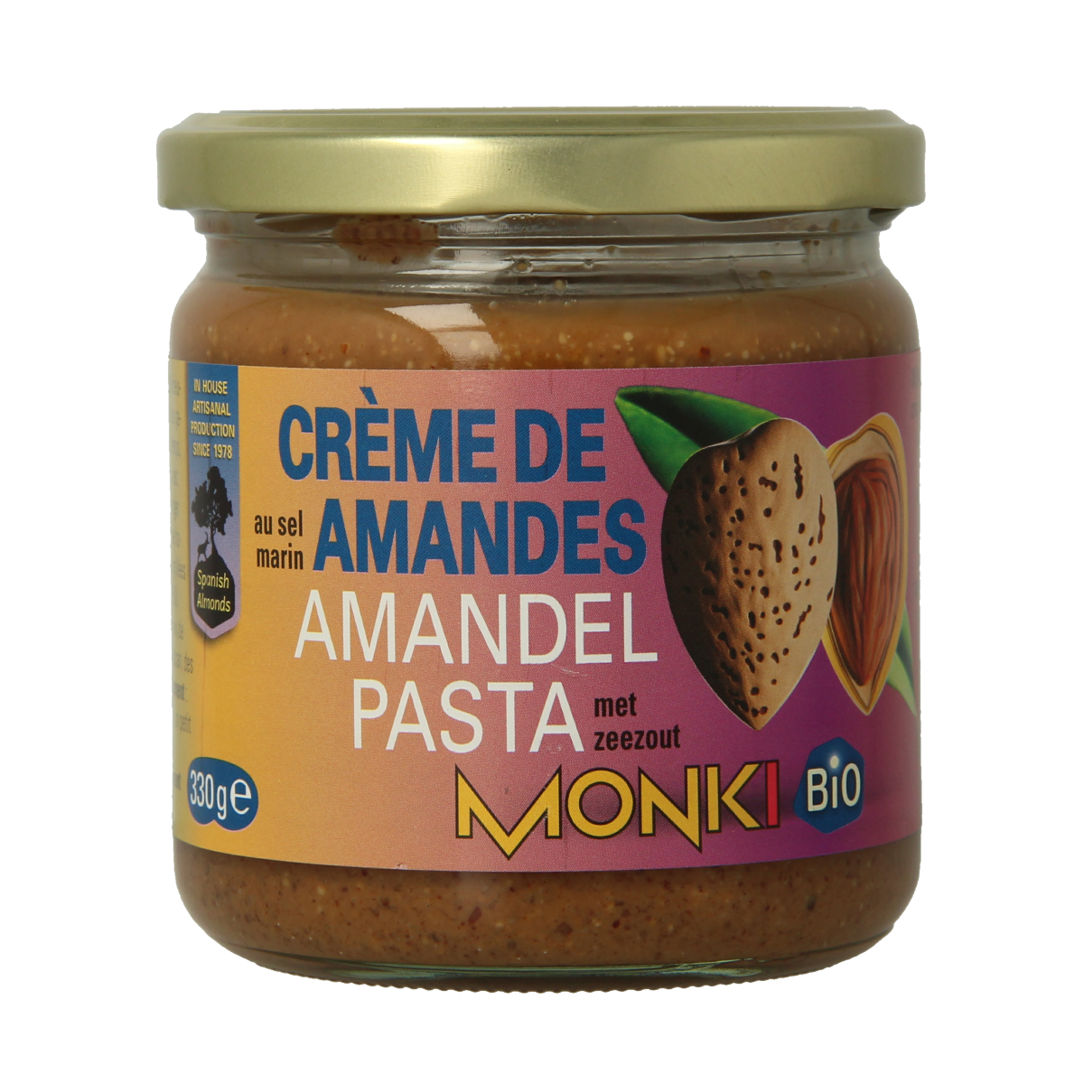 Organic almond butter with salt from Monki, 330 grams, spread on bread, showing creamy almond paste with salt crystals.