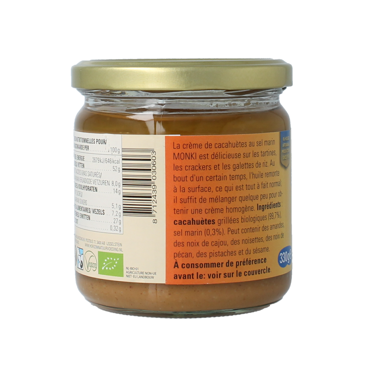 Organic Monki peanut butter with salt, 330 grams, spread on bread, showing the jar with label and creamy texture.