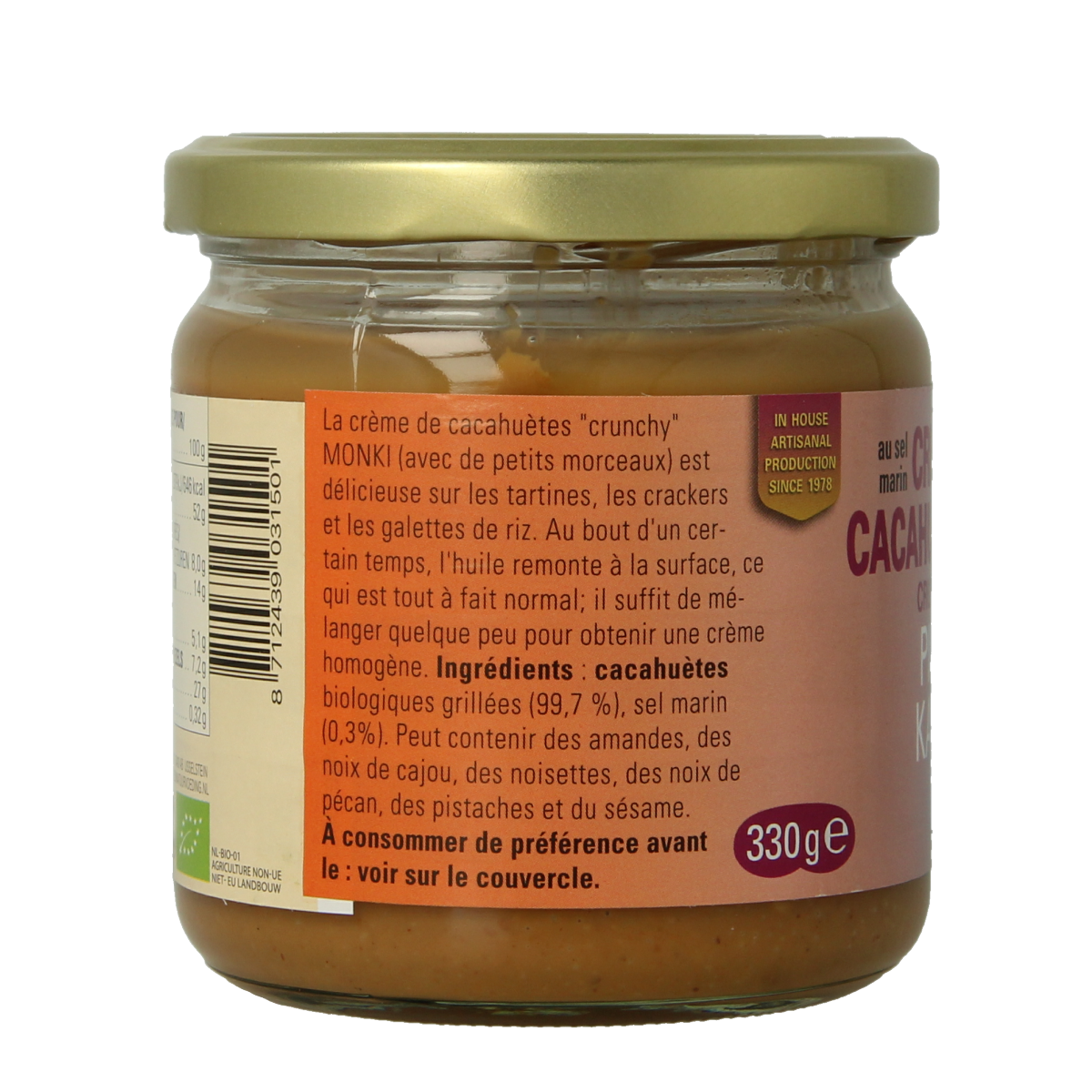 Crunchy Monki organic peanut butter with salt on whole grain bread, showing the jar and spread ready to enjoy.