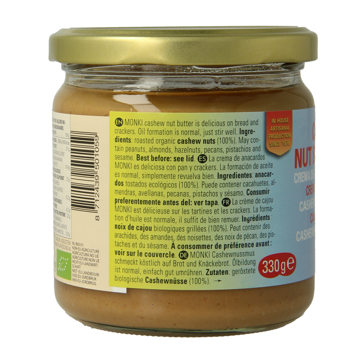 Monki bio cashew nut spread on bread slice, natural broodbeleg with creamy texture and visible cashew pieces.