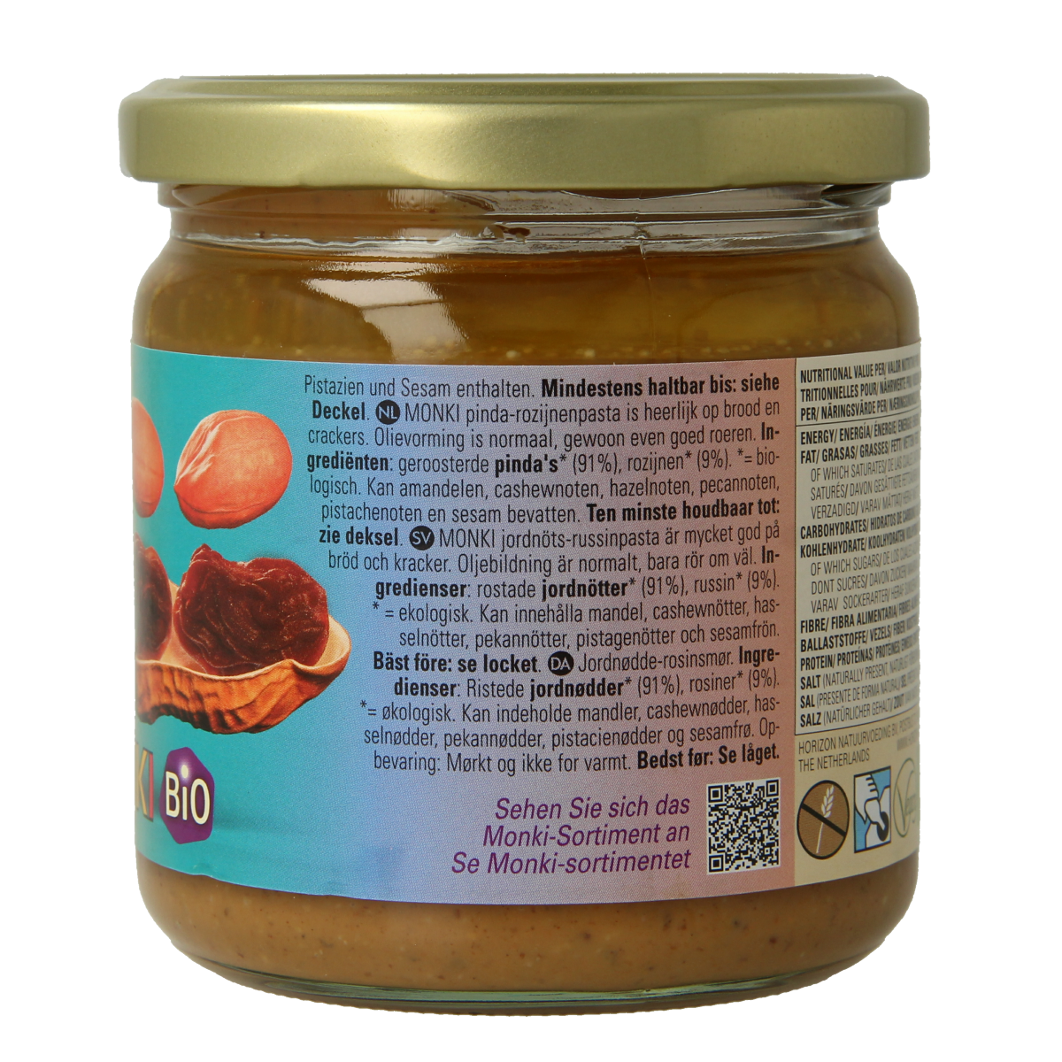 Organic Monki Pinda rozijnenpasta spread on bread, 330g jar with peanut and raisin ingredients, natural and creamy texture.